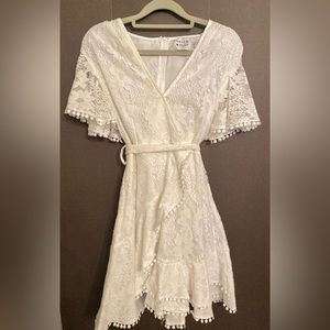 This party dress by Hello Molly is a bright white and size small.